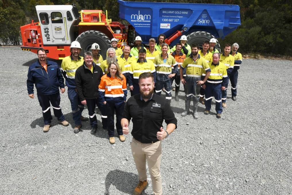 BRIGHT NOTE: Mental health champion and former NRL Dragon Dan Hunt and Ballarat Gold Mine staff introduce a blue truck on site as a reminder to look out for other. Picture: Lachlan Bence