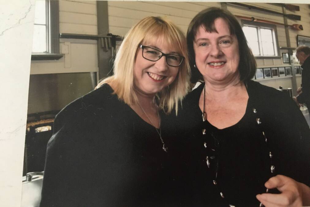 FAMILY TIES: Sue Huffer (right, pictured with sister Fiona Henderson) will spend Christmas in hotel quarantine, having flown in from the United States to see her family before New Year.