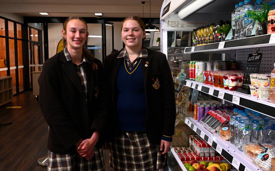 Ballarat Grammar students Mackayla Culvenor, year 10, and Winnie Tayler, year 11, say it is nice to feel more included with lots of options in the school canteen that help meet their dietary requirements. Picture by Adam Trafford