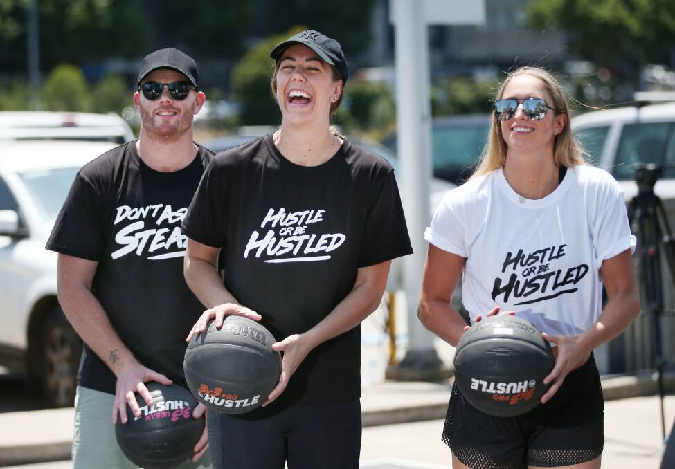 PLAY TIME: Former AFL player Adam Cooney with basketballers Jenna O'Hea and Rebecca Cole at the launch of a new three-on-three national league. Picture: David Crosling