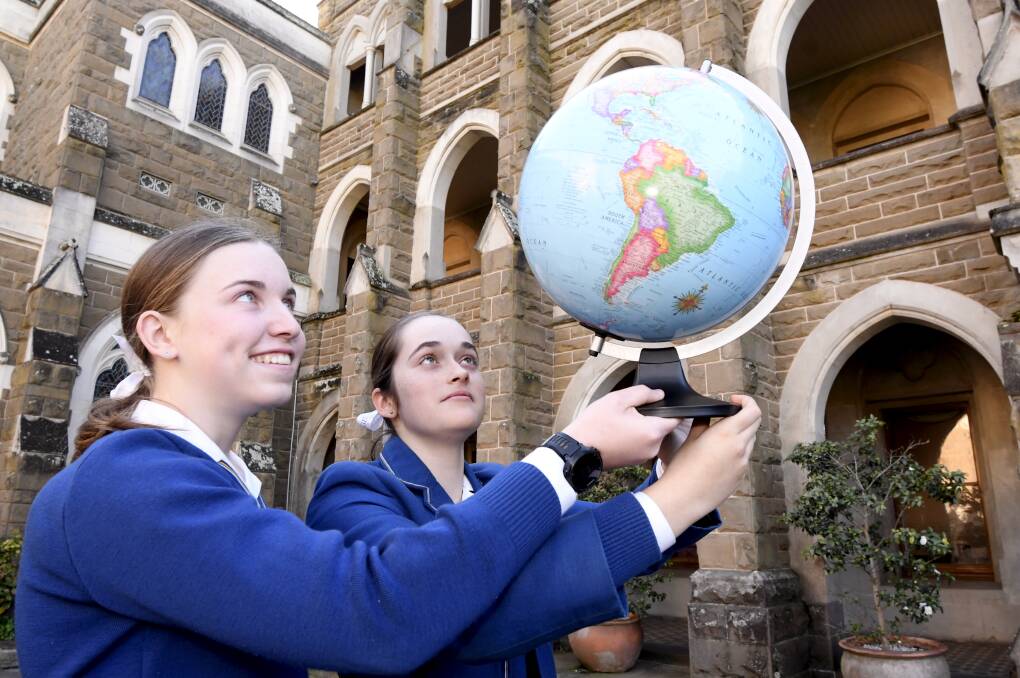 OUTTA THIS WORLD: Loreto students Casey Dodd and Rose Britt visited NASA for space camp two years ago and say this week's launch was a good reminder what was possible in their study pathways. Picture: Lachlan Bence
