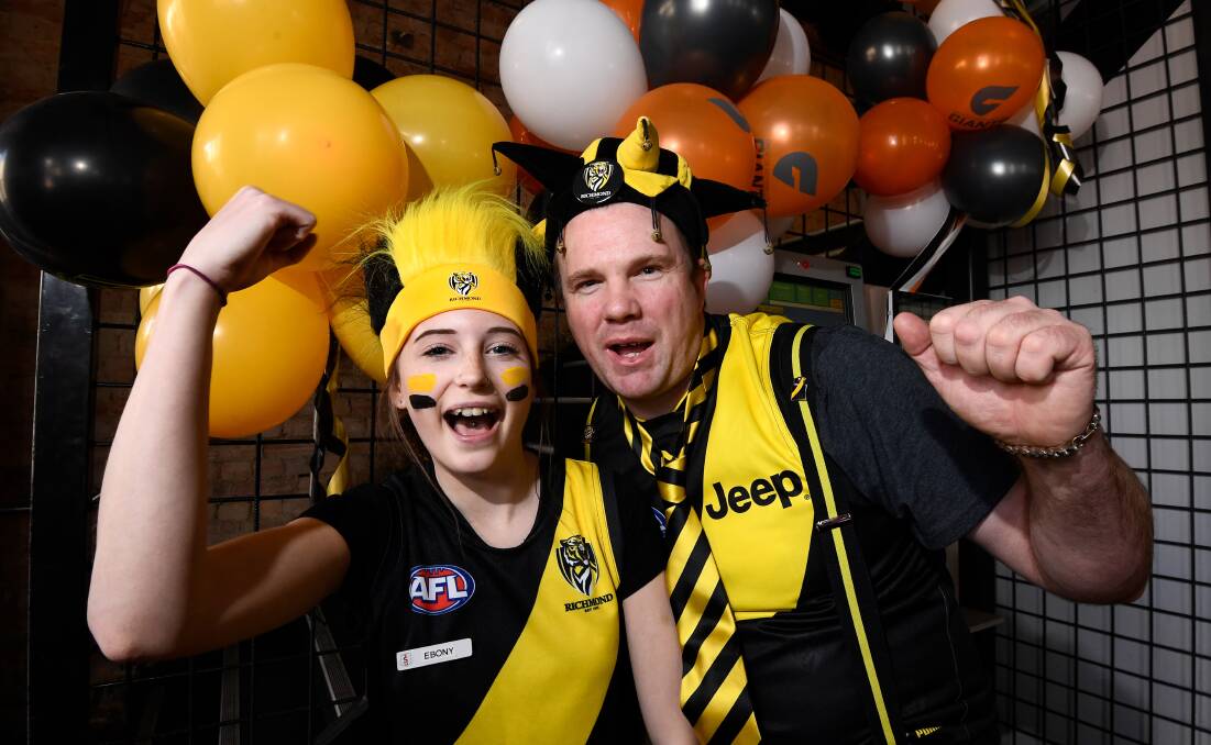 ROAR: The Sporting Globe's Ebony Calaby and Michael Karfut get fired up for one of Australian sports' biggest afternoons. Picture: Adam Trafford
