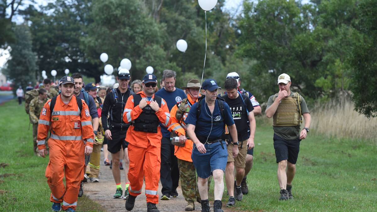 UNITY: State Emergency Service crews step out in uniform for Walk Off the War Within about Victoria Park in 2017.