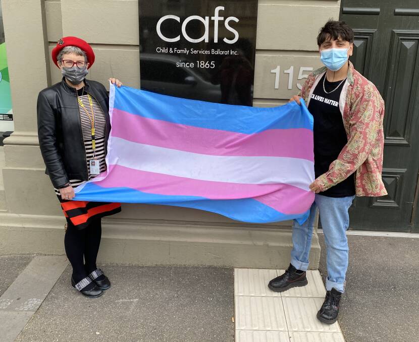 WELCOME: Cafs chief Wendy Sturgess and Sage Akouri raise the transgender flag for the first time in Ballarat in a show of inclusion and visibility for the community's transgender and gender diverse peoples.