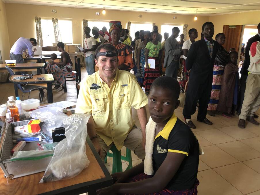 MISSION: Peter Bartlett re-visits a hearing and training clinic in Malawi last month.