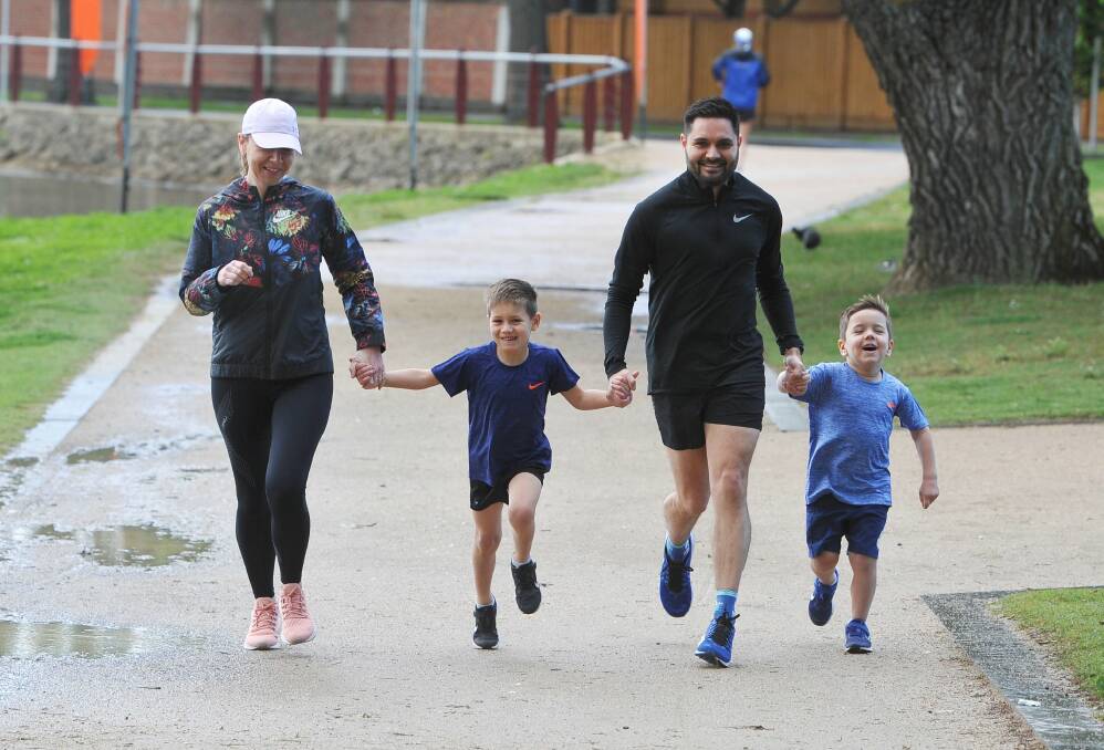 FAMILY SUPPORT: Rachael and Matt Cash with sons Thomas (age six) and Lewis (four) will be out cheering on each other's efforts in Run For A Cause on Sunday. Picture: Lachlan Bence
