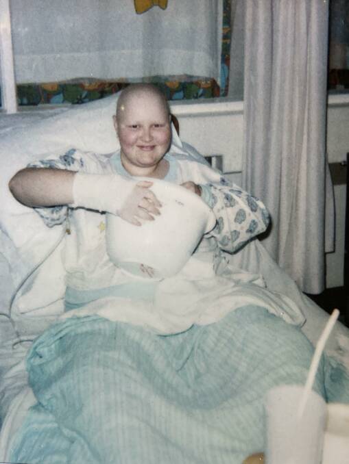 COOKING IDEAS: Fiona mixing a cake batter from her hospital bed at Royal Children's hospital.