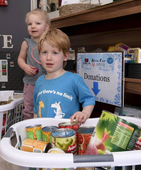 SUPPORT: Two-year-old Charli and three-year old Rusty help call for donations to the 3BA Winter Appeal at Goodstart Early Learning in Mount Clear. Picture: Lachlan Bence 