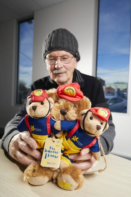SUPPORT: Ballarat Daffodil Day site manager Robert Petrie with the well-loved Cancer Council bears on sale, this year in fire-fighting apparel, available from stalls next month. Picture: Luka Kauzlaric