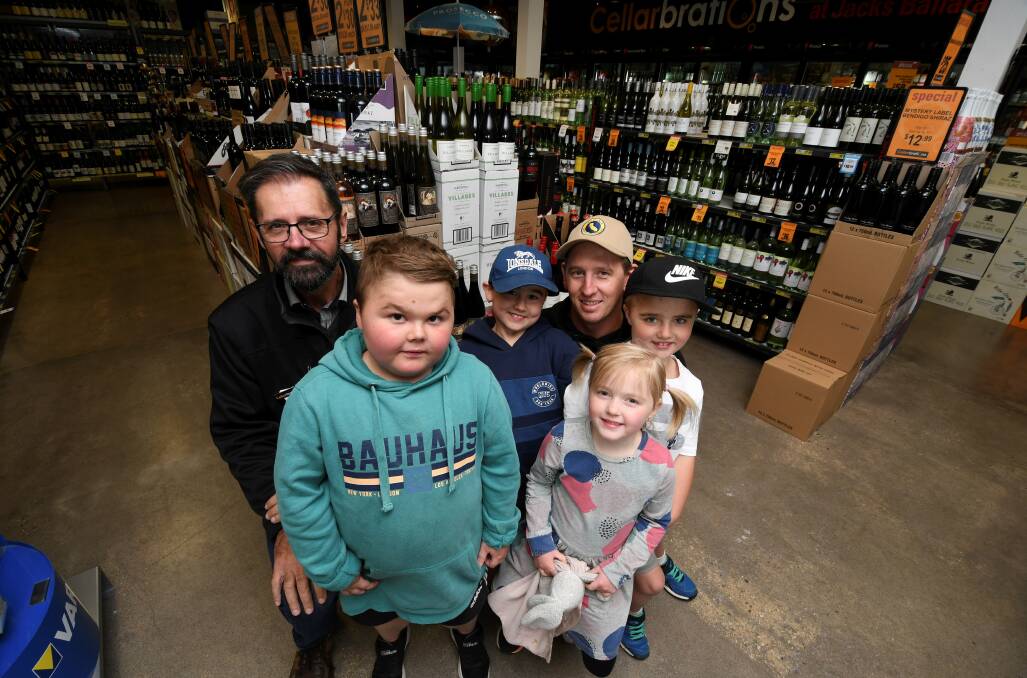RETURN: Shorter brothers Max, Will and Hudson visit Cellarbrations' Jack Simic with dad Leigh and Sofia for the inaugural wine offer last year.