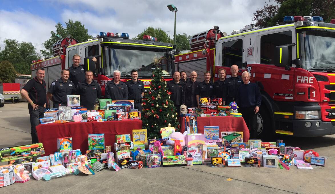 GENEROUS: Ballarat City and Lucas fire fighters have been busy building a pile of presents to help out the community's most needy this Christmas.