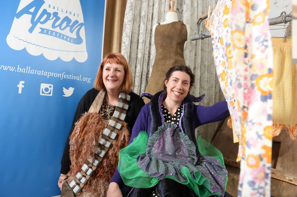 STITCHED UP: Lynne Sheedy and Lori Howlett channel the more fantastical elements of aprons, like Star Wars' Chewbacca, for last year's Ballarat Apron Festival. Picture: Kate Healy