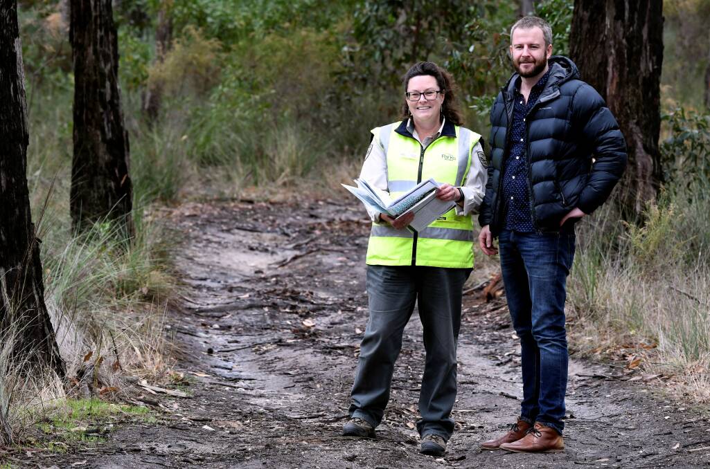 BEGINNING: Parks Victoria's Siobhan Rogan and Josh Maher set out on the location for the state's first dementia-friendly trail walk in Ballarat East. Picture: Lachlan Bence