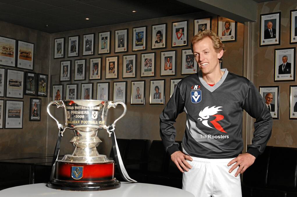 BELIEF: Roosters captain Shaune Moloney reflects on the 2008 VFL premiership cup. The club went on to win the next two in an historic three-peat. 