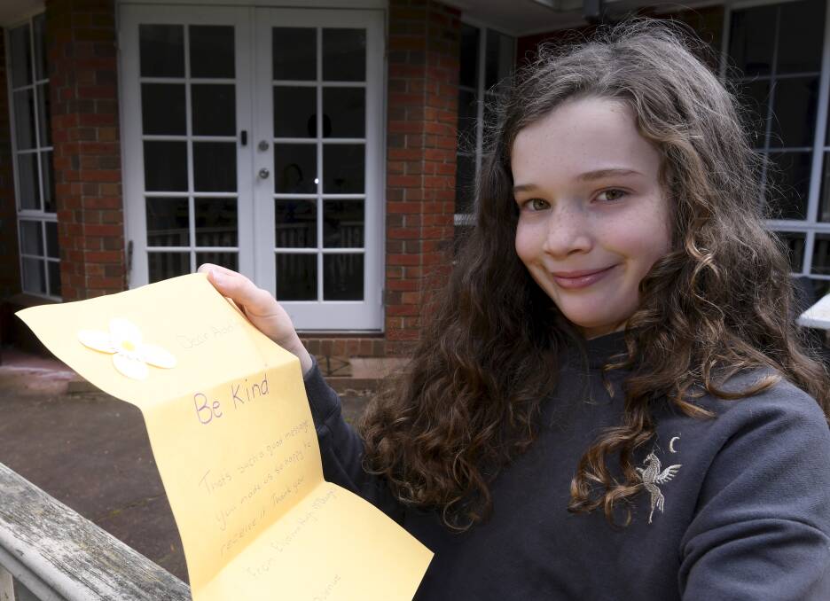 PALS: Seven-year-old Addison wrote kind letters to her neighbours to help make them happy in the lockdowns - and she got some fun replies. Picture: Lachlan Bence