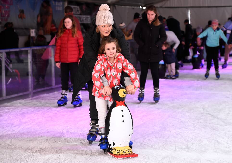 FROZEN FUN: Sylvie with her mother Natalie get into Ballarat Winter Festival spirit with a turn about the ice-skating rink next to the town hall. Picture: Adam Trafford