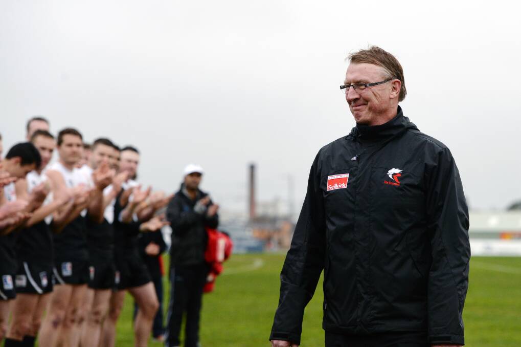 FAREWELL: North Ballarat Roosters players and staff form a guard of honour for decorated coach Gerard FitzGerald in his final match as a Victorian Football League coach in 2015. Picture: Kate Healy