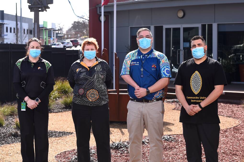 UNITY: Ballarat and District Aboriginal Cooperative's Lisa Timmins, general practitioner Bec Quake, practice manager Paul Kochskamper and nurse Anthony Harrison call on people to roll up their sleeves. Picture: Adam Trafford
