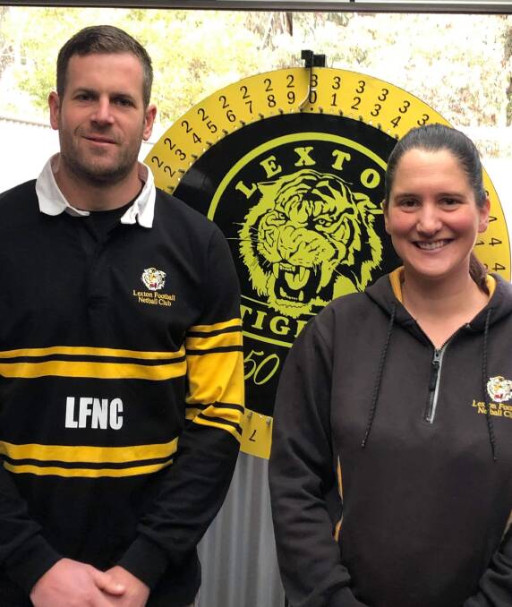FORTUNE: Lexton president Jordan Phelan and wife Rachel, who is the Tigers' netball manager, with the weekly prize wheel for members each Saturday, what would have been game day.