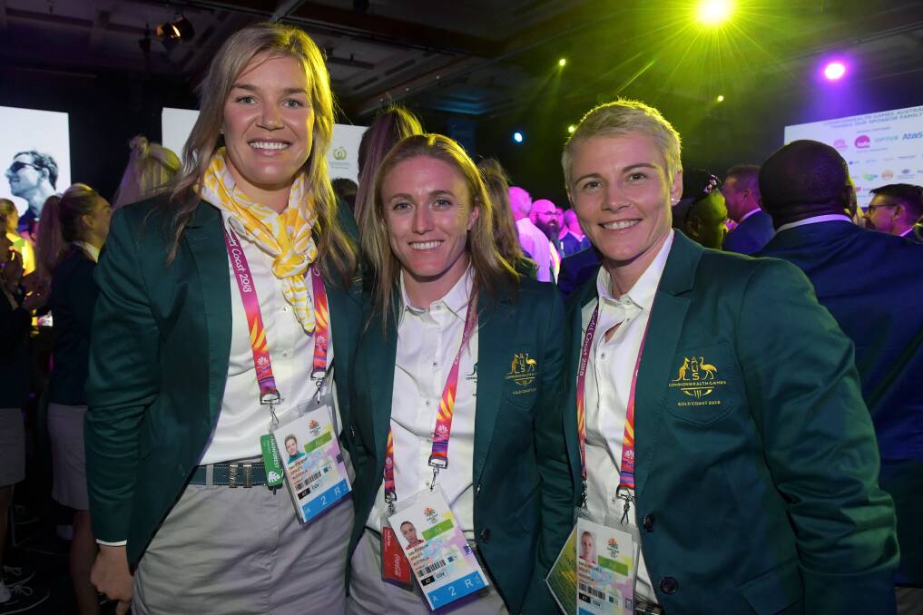 FOCUS: Our in-form javelin thrower Kathryn Mitchell (right) prepares in Games attire with discus thrower Dani Stevens and captain Sally Pearson last weekend. Picture: AAP