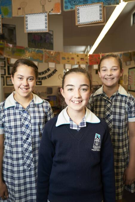 LESSON: Emmaus Catholic Primary School pupils Sophie, Meg and Tara like to find simple ways they can make a big difference in their community. Picture: Luka Kauzlaric