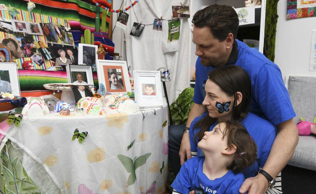 LOVE: Tim and Angela Black with daughter Ashley take comfort in remembering their son in a bright, fun event. Picture: Lachlan Bence