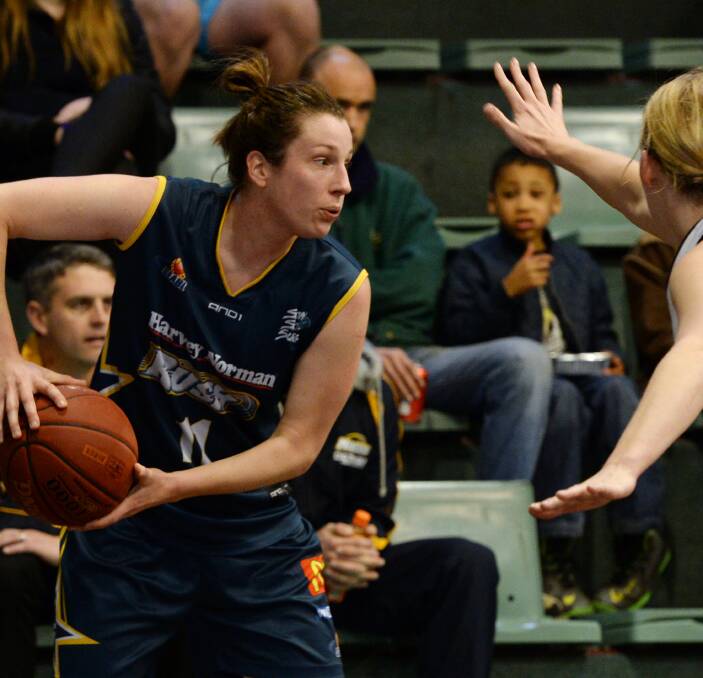 PRESSURE: Rush co-captain Kristy Rinaldi looks to work past Hobart's Kathleen Scheer, who made a big impact on the game in a tight first half. Rinaldi pulled in 10 rebounds. Picture: Kate Healy