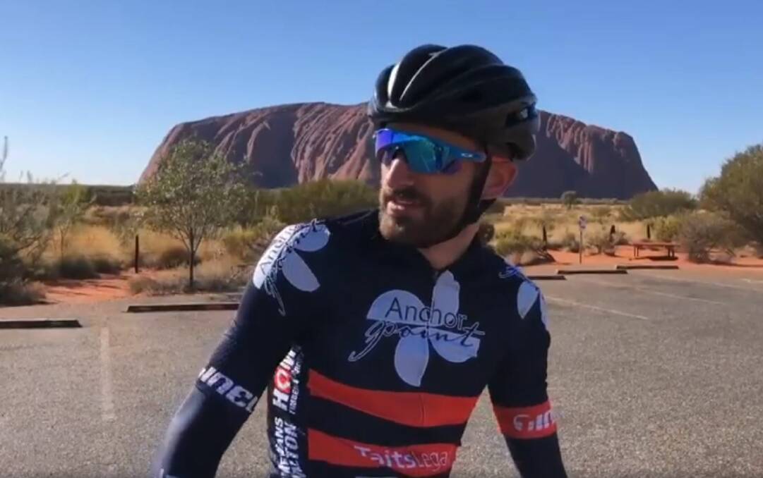 MISSION: Dementia champion Nick Locandro pauses to reflect at Uluru, where his family had their last holiday together, before starting to ride home to honour his dad. Picture: A Ride to Remember - Uluru to Ballarat