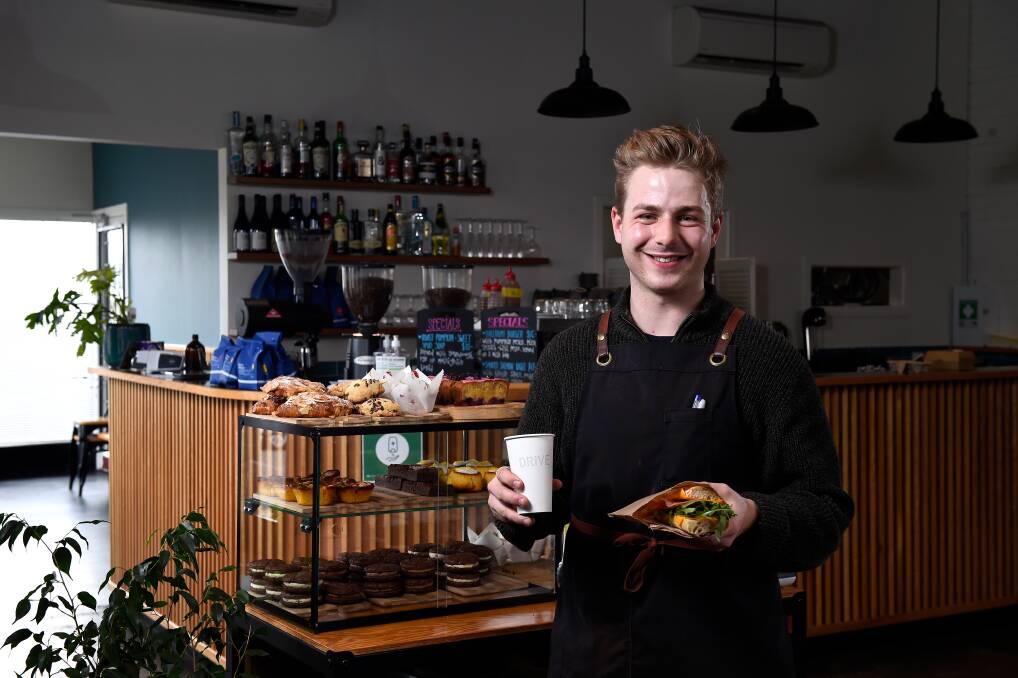 GRATITUDE: Drive's Mitchell Clark gives a taste of the cafe's free lunch on offer for customers as a way to bring a bit of joy to the community and a sign of thanks for support. Picture: Adam Trafford