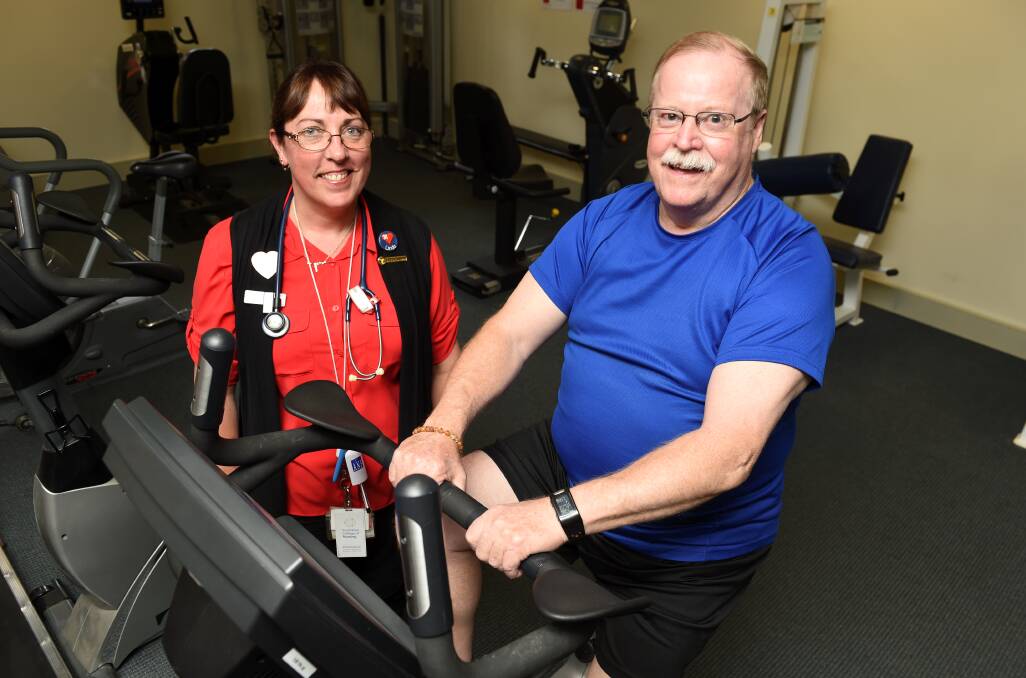 Ballarat health Services clinical nurse Linda Macaulay takes a client through cardiac rehabilitation at the Queen Elizabeth Centre.