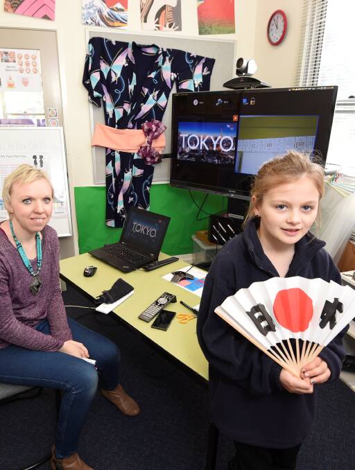BEHIND THE SCENES: Peta Ikeda, with Trawalla grade three pupil Bella, is expanding the school's language program in other regional classrooms. Picture: Lachlan Bence