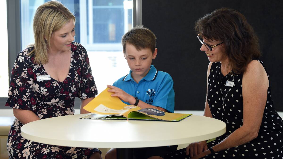 Grade four pupil Toby with Lucas assistant principal Danielle Lee and principal Sue Sawyer. Picture: Kate Healy