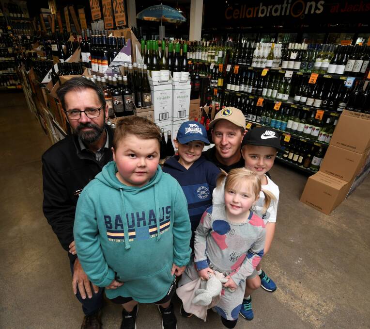 SPOTLIGHT: Cellarbrations' Jack Simic with Shorter brothers Max (age 10), Will (almost nine) and Hudson (six), dad Leigh Shorter and sister Sofia (four). Picture: Lachlan Bence