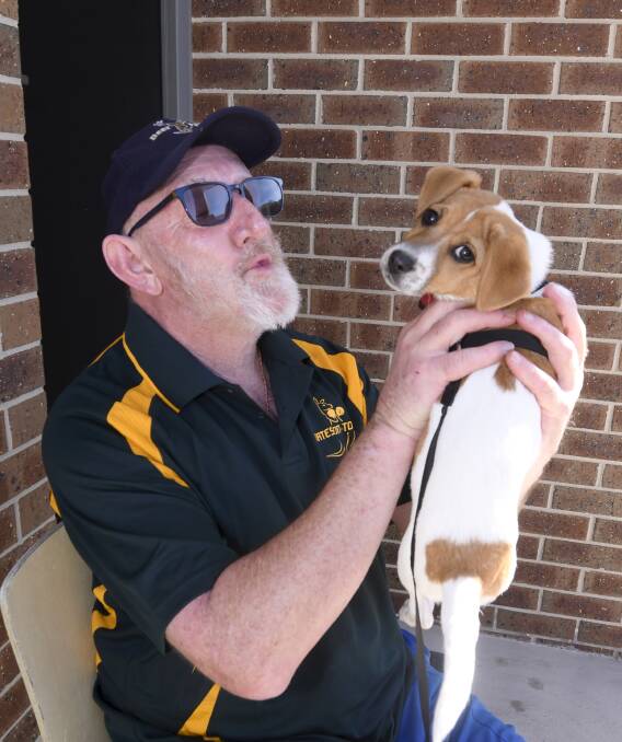 PUPPY LOVE: Active retiree Jeff Grieve has puppy Joey for company but also welcomes the single-person bubble, especially since no sport has limited his interaction with other humans during the pandemic. Picture: Lachlan Bence