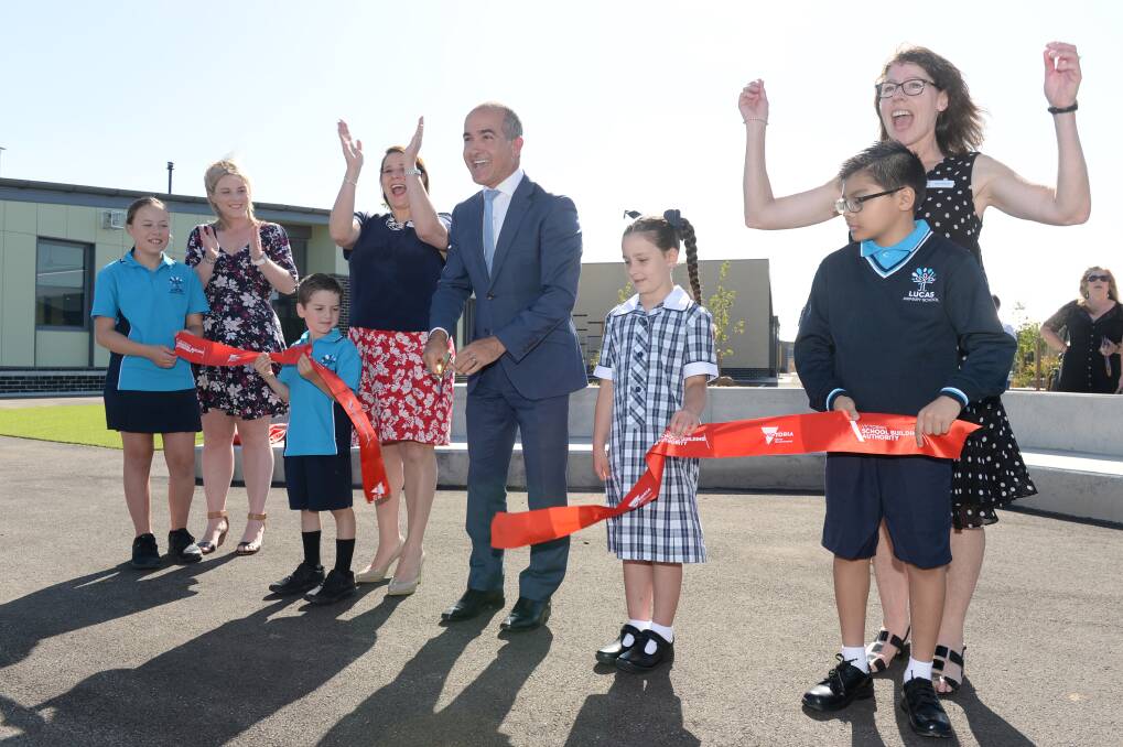 RIBBON CUT: Katie (grade six), assistant principal Danielle Lee , Nathan (prep), Wendouree MP Juliana Addison, Victorian Education Minister James Merlino, Savannah (prep), Jerremy (grade five) and principal Sue Sawyer officially open Lucas Primary School on Thursday morning. Picture: Kate Healy