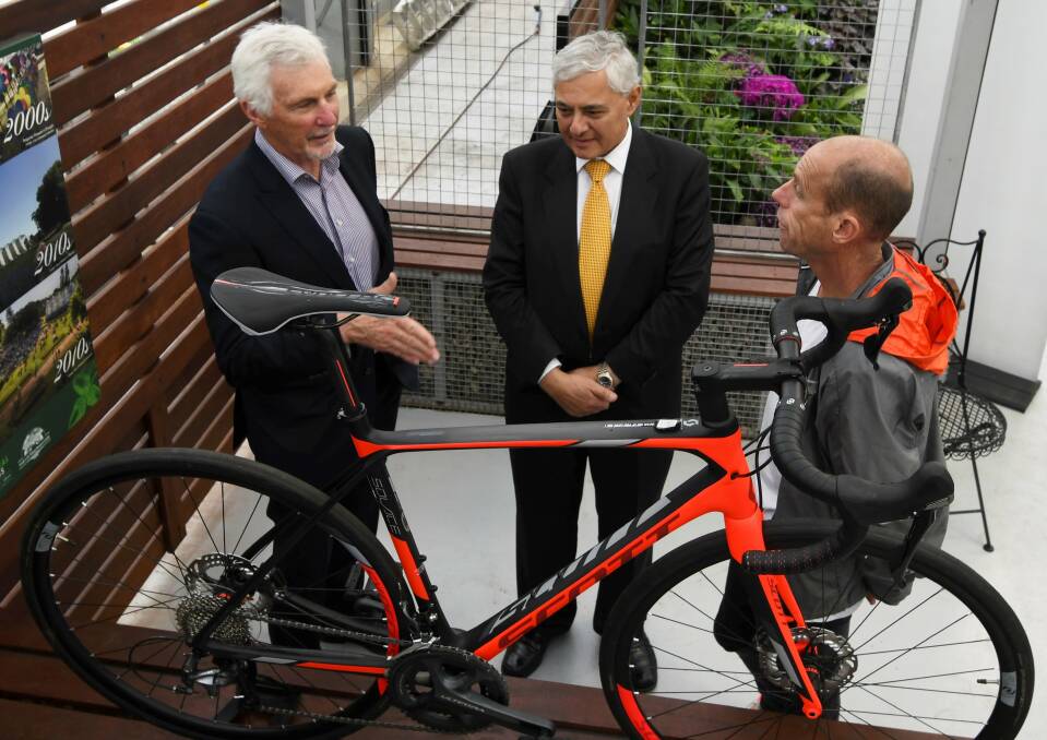 PEDAL: Classic ambassadors Michael Malthouse and Steve Moneghetti with FECRI's George Kannourakis at Friday's launch. Picture: Lachlan Bence