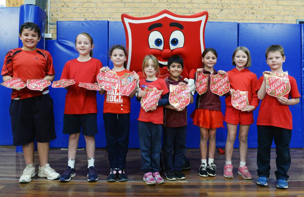 SUPPORT: Delcombe Primary School's student leaders show their shield collections to Shieldy. Picture: Kate Healy