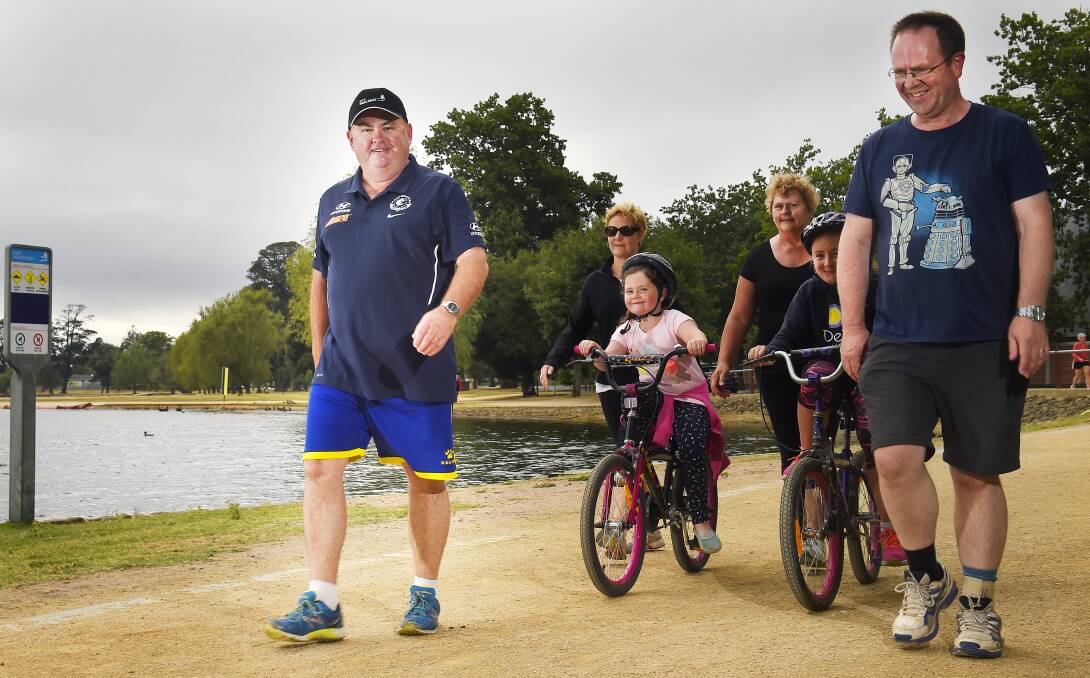 POWER WALK: Des Hudson with support crew in wife Anne, daughters Molly and Emily, Leeanne Wilson, David Westaway. Picture: Luka Kauzlaric