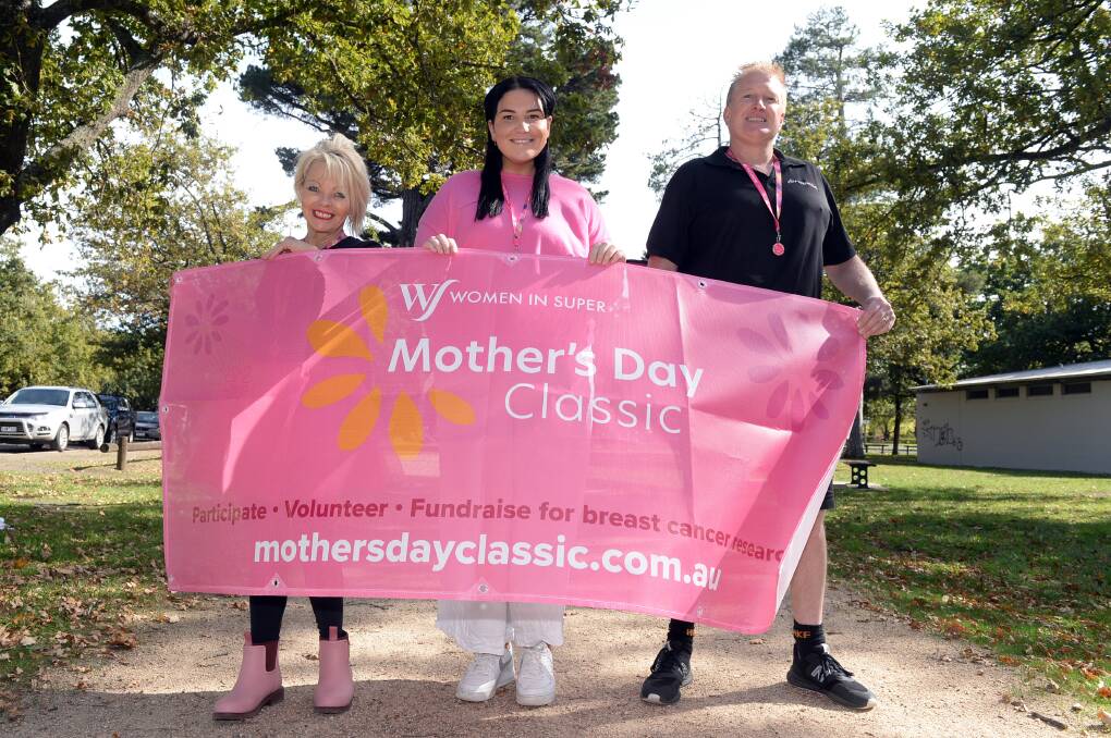 Breast cancer survivor Emily Quinlan (centre) with Fernwood Ballarat's Lee and Brian Squire prepare to step up support for breast cancer research in the Mother's Day Classic in Victoria Park. Picture by Kate Healy