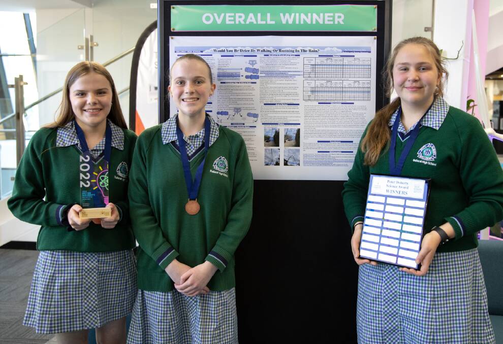 Ballarat High Schhol trio Remee Simmons, Taryn Simmons and Kira Barbary have proven you get less wet running through rain than walking in it.