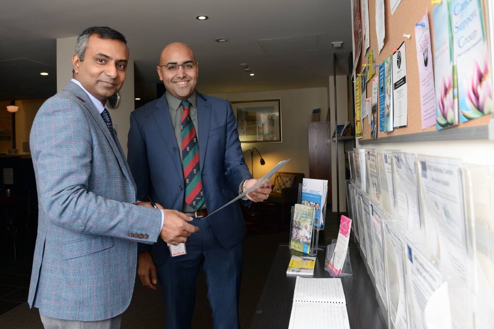 Ballarat Health Services medical oncologists Wasek Faisal and Vishal Boolell check out the therapy programs in Ballarat Regional Integrated Cancer Centre's wellness centre. Picture: Kate Healy