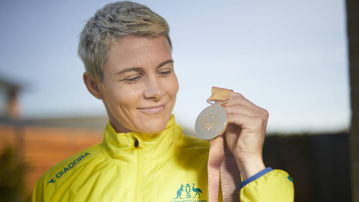 Kathryn Mitchell with her Commonwealth Games javelin gold medal. Picture: Luka Kauzlaric
