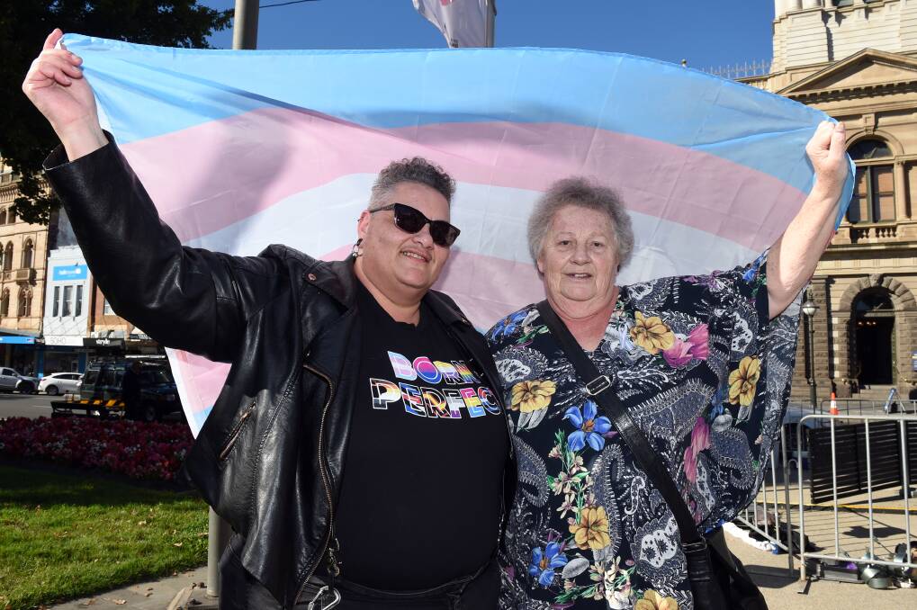 SUPPORT: Ballarat transgender and non-binary champion KL Joy with mum Lynda Genser, proudly carrying the transgender flag outside Ballarat Town Hall on Tuesday morning. Picture: Kate Healy
