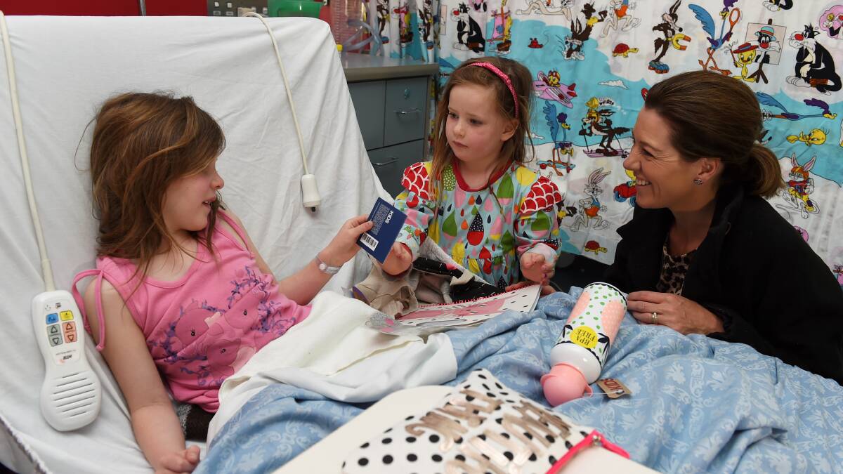 Run Ballarat ambassadors Molly-Rose Coghlan (4) and Gorgi Coghlan meet children's ward patient Chloe Lancey (6). Picture: Lachlan Bence