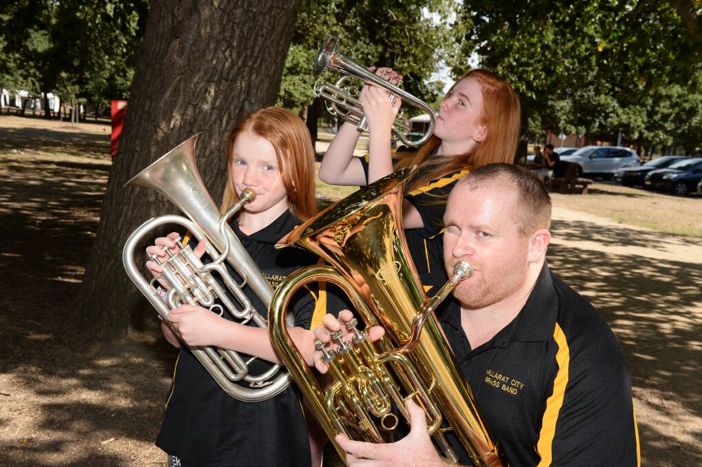 BRIGHT NOTE: Ballarat City Brass Band's Sophia Cheesman, Annabelle Cheesman and Troy Cheesman are warming up. Picture: Kate Healy