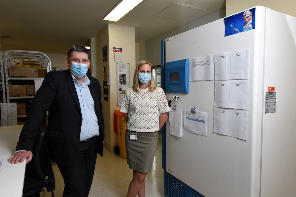READY: Ballarat Health Services chief Dale Fraser and BHS pharmacist dispensary manager Magda Kvasnicka with the new ultra-low temperature freezer to house Pfizer vaccinations. Picture: Adam Trafford