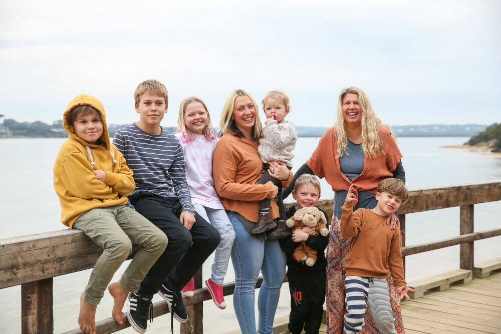 SMILING: The Boo Collective's Georgia Fiske and Jane McLeod, pictured with their children, aim to lead a more sustainable lifestyle and help other families do so too.