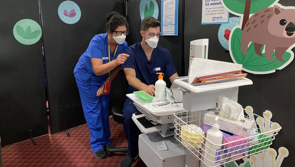NEXT CHAPTER: Grampians regional nurse educator Kirrily Caldow shares her years' experience in COVID-19 vaccinations with medical student Ryan Brown, who started his first day in the community vaccination centre on Monday.