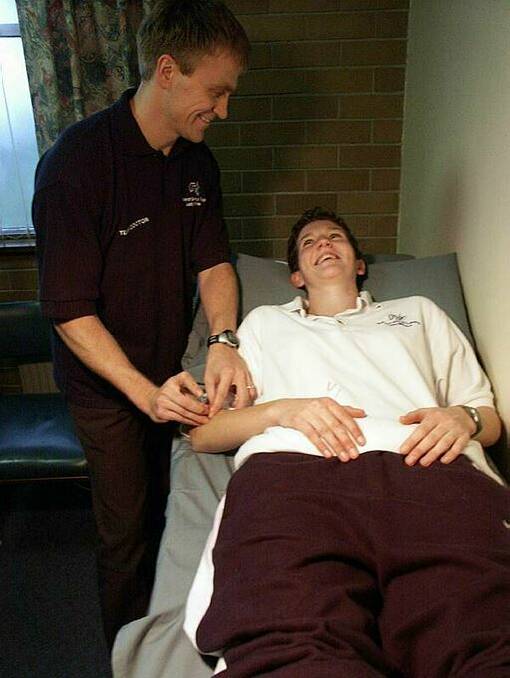 FLASHBACK: Ballarat Lady Miner Desiree Glaubitz receives acupuncture treatment from Lady Miners doctor and Ballarat Group practice practitioner Rimas Liubinas in 2002. Picture: The Courier