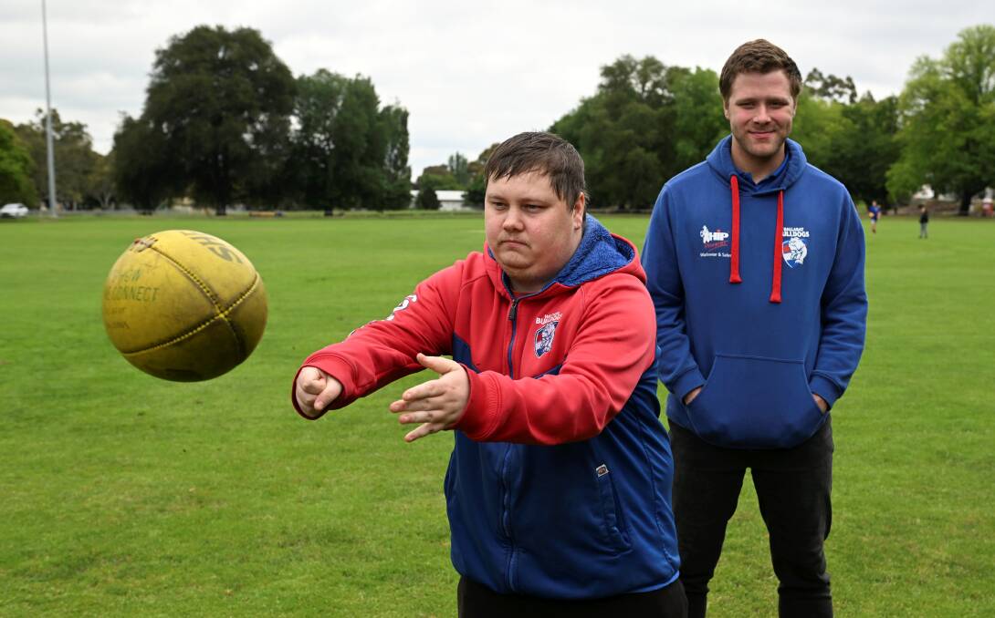 Ballarat Bulldogs Zac Burzacott and Mitchell Hardman are getting in early for encouraging others to come and join their team next season. Picture by Lachlan Bence